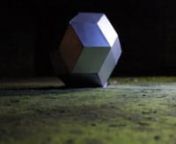 Recount of a rhombic or Triacontahedron Polyhedron Catalan, leaning on a tarmac, rough, like the voice of Eivør that accompanying the video. The light, moving, illuminating the faces of the polyhedron