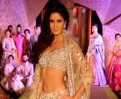 Katrina Kaif flaunts her perfect abs in a silver sequinned lehenga by Manish Malhotra. Aditya Roy Kapoor walks barefoot as the showstopper. Synonymous to all things beautiful, actress Katrina Kaif walked the ramp in a heavily embellished lehenga with interesting mirror work and a full-shimmer choli. She flaunted her oh-so-perfect abs and toned curves in the low-waist lehenga. Kat definitely gave us fitness goals by flaunting a figure like that! Aditya too rocked his traditional outfit of black a