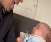 This dad playfully interacted with his baby.&#60;br/&#62;&#60;br/&#62;Suddenly, he noticed a telltale sign that it&#39;s time for a diaper change—a full nappy! With a mix of surprise and humor, he exclaimed to his wife, &#39;That&#39;s gonna leak.&#39;&#60;br/&#62;&#60;br/&#62;This showed his quick thinking in anticipating the messy situation. Despite his initial amusement, the dad&#39;s discomfort with the smell became evident.&#60;br/&#62;&#60;br/&#62;This prompted him to request his wife&#39;s help in handling the situation.&#60;br/&#62;&#60;br/&#62;It&#39;s a charming reminder of the everyday joys and challenges of parenthood, filled with love and laughter.&#60;br/&#62; &#60;br/&#62;Location: Manchester, United Kingdom&#60;br/&#62;WooGlobe Ref : WGA137123&#60;br/&#62;For licensing and to use this video, please email licensing@wooglobe.com