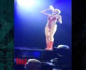 Miley Cyrus fans are hardcore, because when Miley started spitting water over them.