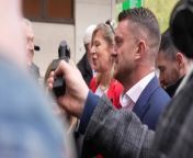 Tommy Robinson arrives at court accompanied by Katie HopkinsPA