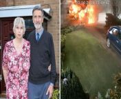 *ADDITIONAL FOOTAGE*&#60;br/&#62;&#60;br/&#62;Shocking footage shows an ambulance explode into a fireball - moments after an elderly patient is dropped off at home. &#60;br/&#62;&#60;br/&#62;David and Marilyn Brinklow were having a cup of tea when they heard a huge bang and saw flames engulfing their front garden.&#60;br/&#62;&#60;br/&#62;Minutes earlier, a private ambulance had dropped off the couple’s 91-year-old wheelchair-bound neighbour after a hospital stay. &#60;br/&#62;&#60;br/&#62;Footage shows two care workers wheeling the woman to her home in Barton-under-Needwood, Staffs., at around 1.45pm on March 14.
