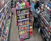 CCTV footage captures a machete wielding thug trying to break out of a West Midlands convenience after a shopkeeper traps him inside