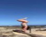 This woman performed a handstand at a beach. While performing, she also showed a few postures related to handstands. She made it look easy and flawless.&#60;br/&#62;&#60;br/&#62;The underlying music rights are not available for license. For use of the video with the track(s) contained therein, please contact the music publisher(s) or relevant rightsholder(s).