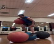 This athlete showed their incredible balancing skills by performing several gym ball tricks. They started by balancing on a gym ball and spinning a kettlebell while being blindfolded. They then hopped on three gym balls in a row while holding one under their arm.&#60;br/&#62;&#60;br/&#62;*The underlying music rights are not available for license. For use of the video with the track(s) contained therein, please contact the music publisher(s) or relevant rightsholder(s).